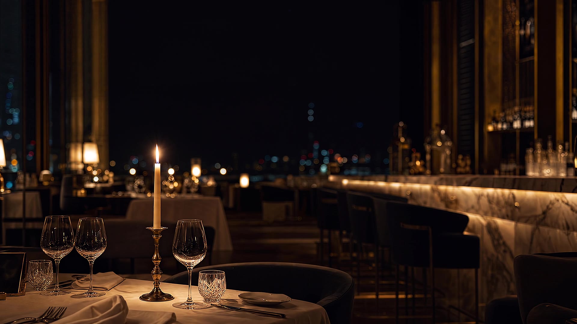A single candlelit table in an empty restaurant